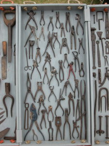 A top view of a drawer of various wrenches and pliers; entrancing and calming. Tools.